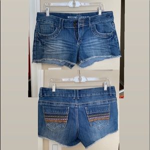 Mossimo cutoff jean shorts with colorful design on back pockets, size 11